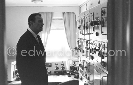 John Wayne on board Onassis' yacht Christina. Monaco harbor 1955. - Photo by Edward Quinn