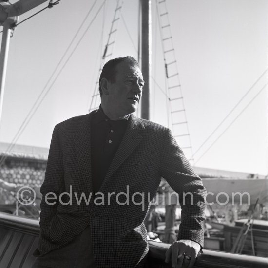 John Wayne on board Onassis\' yacht Christina. Monaco harbor 1955. - Photo by Edward Quinn