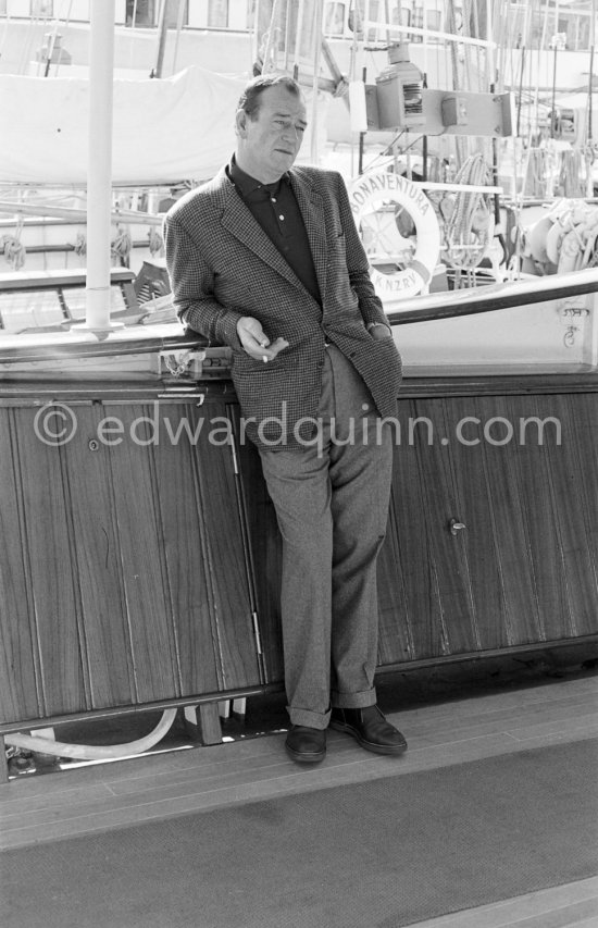 John Wayne on board Onassis\' yacht Christina. Monaco harbor 1955. - Photo by Edward Quinn