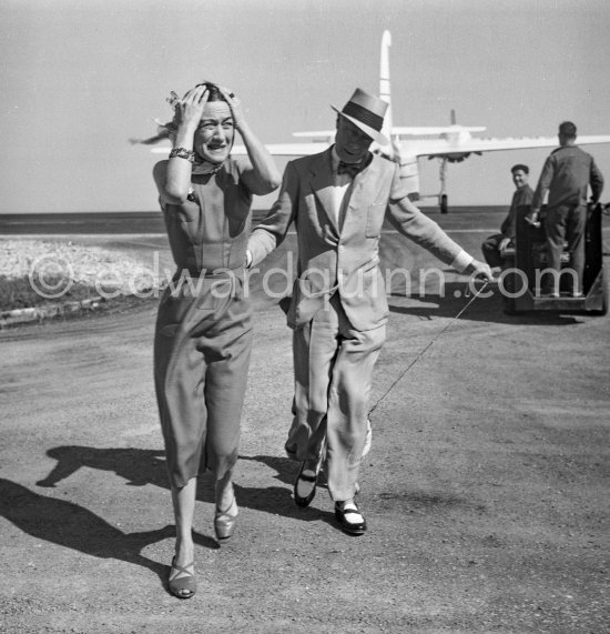 Edward Duke of Windsor and the Duchess of Windsor. and their pet dog Preezie. Nice Airport 1954. - Photo by Edward Quinn