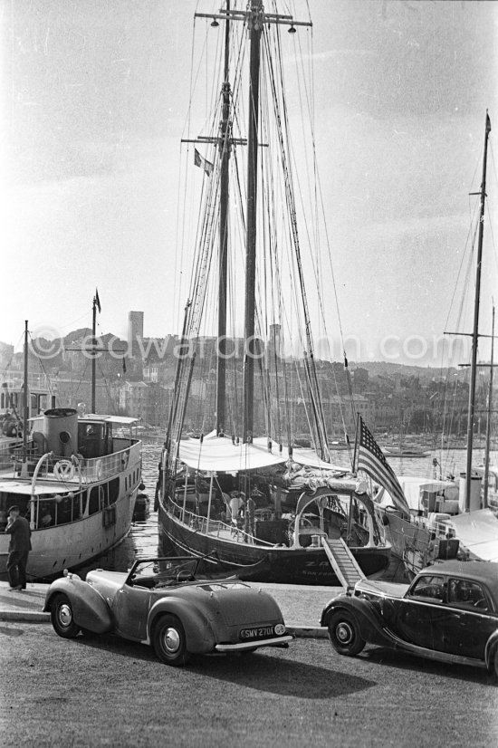 Yacht, not yet identified. Antibes harbor about 1952. Car: 1949/50 Triumph 1800 Roadster - Photo by Edward Quinn