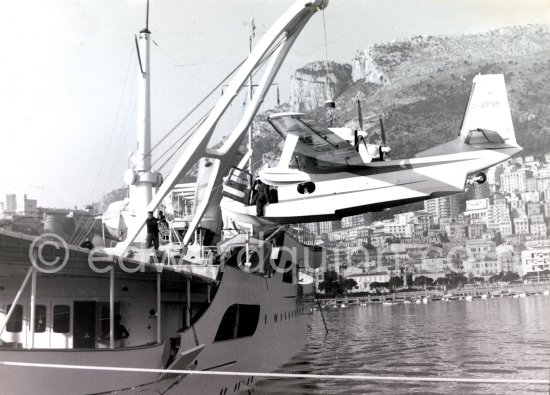 Onassis\' yacht Christina with aircraft G-APNY Piaggio P-136L SERIES 2 C/N 242. Monaco harbor about 1955. - Photo by Edward Quinn