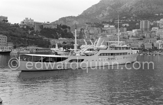 Onassis' yacht Christina with Italian twin-engine amphibian flying boat G-APNY Piaggio P-136L SERIES 2 C/N 242. Monaco harbor with the palais in the background 1955. - Photo by Edward Quinn
