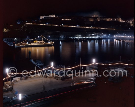 Yacht Christina of Aristotle Onassis lit up in harbor. Monaco 1954. - Photo by Edward Quinn