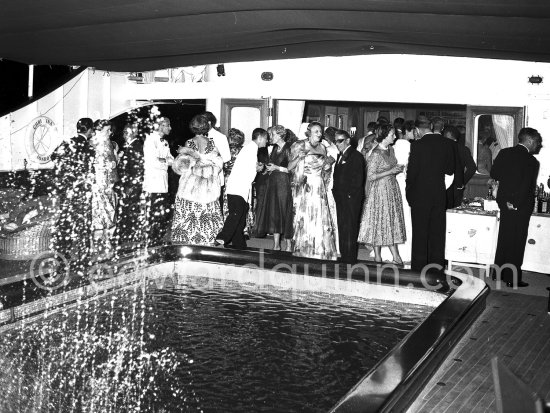 Cocktail on bord the "Christina", yacht of Aristotle Onassis. Monaco harbor 1954. - Photo by Edward Quinn