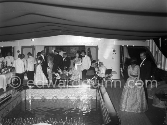 Cocktail on board the yacht Christina. Monaco harbor. August 1956. - Photo by Edward Quinn