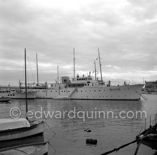 Yacht Trenora being built by Thornycrofts. Monaco harbor 1954. This yacht was ordered by a ‘distinguished English Surgeon in Paris’ named Mr Gerald Stanley. He ordered it to provide work for British shipworkers during a period of depression. The yacht was built to a high degree of luxury, but in 1940 it joined the Canadian navy as \'HMCS Sans Peur\' (Fearless) and was fitted out as an Armed Yacht with a 4” gun on the foredeck. - Photo by Edward Quinn