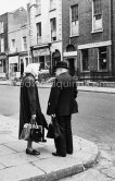 A side street off O'Connell Street. Dublin 1963. Published in Quinn, Edward. James Joyces Dublin. Secker & Warburg, London 1974. - Photo by Edward Quinn