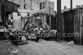Leather stall. Anglesea Market, Dublin's secondhand market in a laneway off Moore Street. Dublin 1963. - Photo by Edward Quinn