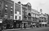 The Irish Times newspaper's clock, on the offices on D'Olier Street. Dublin 1963. - Photo by Edward Quinn