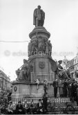 Waiting for President Kennedy to drive past during his visit. O'Connell Monument, Bachelor's Walk / O'Connell Street. Dublin 1963. - Photo by Edward Quinn