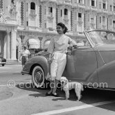 Princess Ashraf, sister of the Shah of Persia, blouse and wallet matching, posing in front of Carlton Hotel with her poodle. Cannes 1953. Car: 1951-58 Mercedes-Benz 300 S Roadster - Photo by Edward Quinn