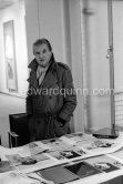 Francis Bacon signing litho "Triptych 1974 - 1977" (1981) at Marlborough Gallery London 1981. - Photo by Edward Quinn