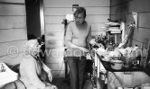 Francis Bacon at his Reece Mews kitchen with his cleaning lady Jean Ward. London 1979. - Photo by Edward Quinn