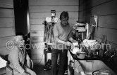 Francis Bacon at his Reece Mews kitchen with his cleaning lady Jean Ward. London 1979. - Photo by Edward Quinn