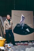 Francis Bacon with the painting "Carcass of Meat and Bird of Prey" at his Reece Mews studio in London 1980. - Photo by Edward Quinn