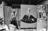 Francis Bacon with the painting "Carcass of Meat and Bird of Prey" at his Reece Mews studio in London 1980. - Photo by Edward Quinn