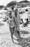 Eddy Barclay, French bandleader and owner of a record company and Israeli actress, singer and model Daliah Lavi and her Toy Poodle. Saint-Tropez 1963. - Photo by Edward Quinn