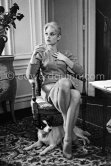 Brigitte Bardot with her mixed breed Guapa at the Hotel Negresco. Nice 1958. - Photo by Edward Quinn