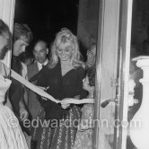Brigitte Bardot opening an exhibition at Saint-Tropez 1958. - Photo by Edward Quinn
