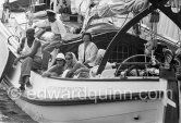 Princess Beatrix of the Netherlands, later Queen, on her boat De groene Draeck (laughing, with white jacket) In front with shawl and sunglasses her sister Irene. Saint-Tropez 1958. - Photo by Edward Quinn