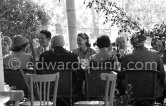 Ingrid Bergman at lunch. On the left the Cannes Festival founder and president Robert Favre Le Bret, right film director Otto Preminger. Cannes 1956. - Photo by Edward Quinn