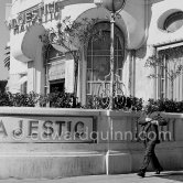 Charlie Chaplin pictured walking past the Hotel Majestic in Cannes, 1953. - Photo by Edward Quinn