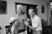 Charlie Chaplin with his daughter Josephine interviewed for a radio station. Chaplin was in Cannes to talk to the press about his latest film, "A King in New York", due to be premiered in London. When asked why he was wearing white gloves, he said it wasn't coquetry, but a slight case of eczema. Villa Lo Scoglietto, Saint-Jean-Cap-Ferrat, 1956. - Photo by Edward Quinn