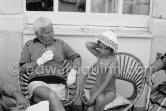 Charlie Chaplin with his daughter Josephine. Chaplin was in Cannes to talk to the press about his latest film, "A King in New York", due to be premiered in London. When asked why he was wearing white gloves, he said it wasn't coquetry, but a slight case of eczema. Villa Lo Scoglietto, Saint-Jean-Cap-Ferrat, 1956. - Photo by Edward Quinn