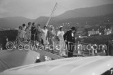 On several occasions Sir Winston Churchill was a guest on Onassis' yacht Christina anchored in the harbor of Monaco. Behind a sailor is Lady Churchill. Monaco 1959. - Photo by Edward Quinn