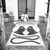 Jean Cocteau with his mosaic at Villa Santo Sospir. Saint-Jean-Cap-Ferrat 1952. - Photo by Edward Quinn