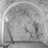 Jean Cocteau working on the mural of the Chapelle Saint Pierre. Villefranche-sur-Mer 1956. - Photo by Edward Quinn