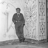 Jean Cocteau working on the mural of the Chapelle Saint Pierre. Villefranche-sur-Mer 1956. - Photo by Edward Quinn