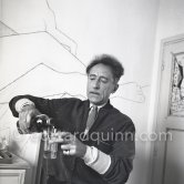 Jean Cocteau at Villa Santo Sospir of his close friend Francine Weisweiller in front of one of the murals he made for the interior walls. Saint-Jean-Cap-Ferrat 1954. - Photo by Edward Quinn