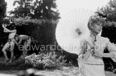 Francine Weisweiller and "L'homme chien" (Guy Dute and Jean-Claude Petit). During filming of "Le Testament d’Orphée", film of Jean Cocteau. Saint-Jean-Cap-Ferrat 1959. - Photo by Edward Quinn