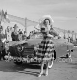 Concours d’élégance Automobile, Catégorie C: Studebaker Champion Regal Convertible 1951, No. 21 of Mr. Duchasseint, won the Prix d’Honneur with a poodle and Janine Lagarde, "Miss Montmartre." Cannes 1951. - Photo by Edward Quinn