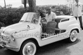 Gary Cooper's long legs fit well into the beach buggy of English millionaire James Hanson. Eden Roc, Cap d’Antibes 1959. Car: 1959 Fiat 600 Jolly. - Photo by Edward Quinn
