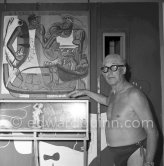 Le Corbusier (Charles-Édouard Jeanneret) with his painting L'Etoile de Mer at the small restaurant attached to his vacation cabin Le Cabanon, Roquebrune-Cap-Martin 1953. - Photo by Edward Quinn