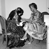 Bella Darvi and the Monte Carlo fortune teller Madame Delyane. Réveillon dinner, Monaco 1955. - Photo by Edward Quinn