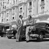 Kirk Douglas and Edward G. Robinson in front of Carlton Hotel. Cannes 1953. Car: Buick Super 1948 - Photo by Edward Quinn