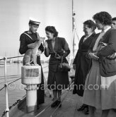 Locals visiting HMS Magpie. A sailor of HMS Magpie with its mascot "Ginger". The ship was the only vessel commanded by Prince Philip, Duke of Edinburgh, who took command on 2 September 1950, when he was 29. The Duke of Edinburgh was on an official 5-days visit with the Royal Fleet to Monte Carlo, Feb. 1951 - Photo by Edward Quinn