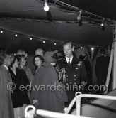 A reception on HMS Magpie. The Duke of Edinburgh, Prince Philip, on an official 5-days visit with the Royal Fleet to Monte Carlo, Feb. 1951. The ship was the only vessel commanded by Prince Philip, Duke of Edinburgh, who took command on 2 September 1950, when he was 29. - Photo by Edward Quinn