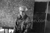 Max Ernst. Behind him the painting "Tremblement de terre printanier". Seillans 1966. - Photo by Edward Quinn