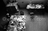 Max Ernst working on a collage at his studio. Seillans 1975. - Photo by Edward Quinn