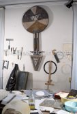 Max Ernst's tools at his studio. With an African tribal art mask. Paris 1974. - Photo by Edward Quinn