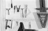 Max Ernst's tools at his studio 4. With an African tribal art mask. Paris 1974. - Photo by Edward Quinn