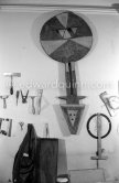 Max Ernst's tools at his studio. With an African tribal art mask. Paris 1974. - Photo by Edward Quinn