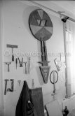 Max Ernst's tools at his studio. With an African tribal art mask. Paris 1974. - Photo by Edward Quinn