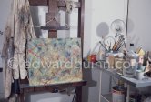 A corner of the studio of Max Ernst with his smock on the easel. Paris 1974. - Photo by Edward Quinn