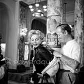 Zsa Zsa Gabor with Earl Blackwell, the head of "Celebrity Service", in the lobby of the Carlton Hotel, during the Cannes Film Festival 1955. - Photo by Edward Quinn